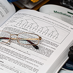 Open research book with charts.
