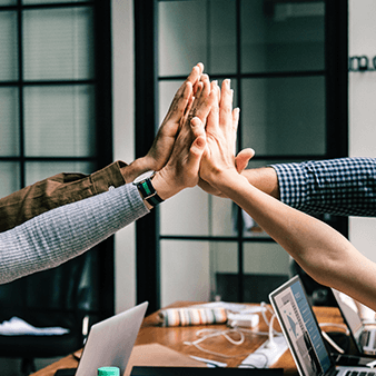 Hands clapping together in success.